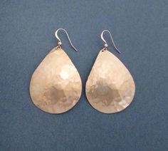 Polished to a rose gold tone, these large hammered bronze teardrop earrings bring modern elegance to everyday outfits. The distressed hammered texture and slightly domed shape add character to the dangles, while the champagne blush color of the bronze metal complements every skin tone. Ear hooks are handcrafted in 14k rose gold filled wire. Tribal inspired with an ultra modern attitude, these earrings can be worn on the weekends with your favorite leggings or with a slinky cocktail dress, also a Elegant Hammered Brass Teardrop Earrings, Hammered Teardrop Earrings, 19th Anniversary Gifts, Bronze Anniversary Gifts, 19th Anniversary, Bronze Anniversary, 7th Anniversary Gifts, Turquoise Drop Earrings, 7th Anniversary