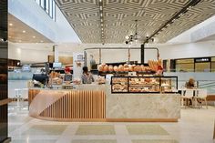 the interior of a restaurant with food on display