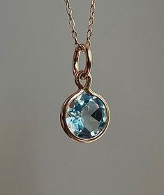 Wonderful natural aquamarine set in solid  14k yellow gold setting.  The gemstone sparkles beautifully and has a very good cut.  VVS clarity! This genuine aquamarine measures 4mm and weighs 0.60 carat. Total pendant weight is 0.35 grams Pendant length (including jump ring) - 15 mm *chain is not included The item shown in the photos is the exact item you will receive upon purchase. Double check dimensions and weight of item to make sure it meets your specifications before ordering. Each piece has Aquamarine Pendant, Yellow Gold Setting, Natural Aquamarine, March Birth Stone, Pendant Set, Necklaces Bracelets, Charm Necklace, Yellow Gold, Jewelry Necklaces