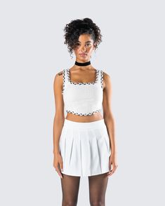 She may look classy, but don't get it twisted 🤍 This ivory bustier, made from tweed fabric and complete with contrast color trim detail, a square neck design, and a v-shaped hem, will add some class and sass to any look 😚 White Cropped Crop Top With Boned Bodice, Fitted White Crop Top With Boned Bodice, White Boned Bodice Crop Top, Fitted White Crop Top With Lace Trim, Trendy White Square Neck Crop Top, Chic Fitted Lace Trim Crop Top, Chic Fitted Crop Top With Lace Trim, White Square Neck Crop Top, White Pleated Tennis Skirt