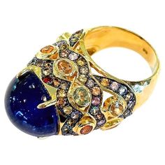 Bochic "Capri” Blue & Multi color Sapphires Ring Set in 18K Gold & Silver Natural Blue Sapphire Cabochon - 12 Carats Natural Multi color Sapphires, round and oval brilliant shapes - 7 carats This Ring is from the "Capri" traveling collection and it is the epitome of elegance and versatility. The ring offers a perfect blend for day to night and swimwear to evening wear, allowing you to effortlessly transition between different occasions and outfits. Wearing this cocktail style ring will undoubtedly make you the center of attention. The ring adds a touch of glamour and sophistication to your favorite caftans, swimwear, or evening attire, enhancing your overall look. The "Capri" collection, from which this ring originates, showcases exceptional craftsmanship and incorporates natural gemstones Sapphire Cabochon, Capri Blue, Natural Blue Sapphire, Cocktail Rings, Evening Wear, Ring Set, Ring Sets, Blue Sapphire, Sapphire Ring