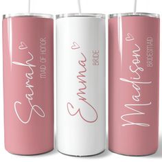 three pink personalized tumblers with the names of two bride and one groom on them