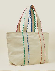 a canvas tote bag with multi - colored trimmings