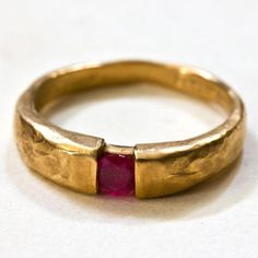 14k Solid Gold Textured Hammered set with 0.24carat natural Burmese ruby  14k 3.3gr. - ruby 0.24c - 980 dolarProduct description: Upper part width is- 4.5mm,lower part width - 2.5mm.ruby diameter - 3.8mmMetal 14k solid gold  weight 3.3 gr.You can also get this ring :You can get this ring also in 18k gold You can get this ring is Rose Pink and white goldYou can set this ring with other stones that suit your style and budget: Diamond, , Emerald, Blue sapphire, Amethyst, Citrine, Black Diamond, Red Handmade Gold Rings, Gold Ring Ruby, Gold Ring Red Stone, Modern Ruby Ring, Raw Ruby Ring, Statement Gold Rings, Elegant Hand Forged Yellow Gold Ruby Ring, Elegant Hand Forged Round Ruby Ring, Anniversary Ruby Rings Hand Forged