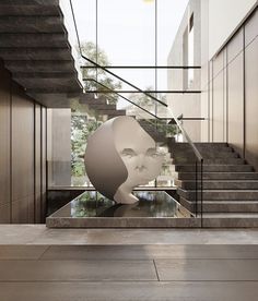 an artistic sculpture in the middle of a room with stairs leading up to it's entrance