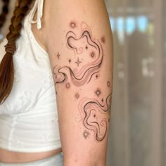 a woman with a tattoo on her arm