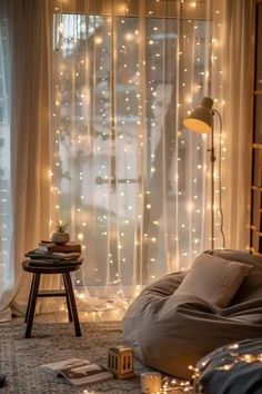 The combination of lights, decorations, and the wooden furniture creates an inviting atmosphere filled with warmth and holiday cheer. Preppy Bedroom With Fairy Lights, Bulb Fairy Lights Bedroom, Sheer Curtains With Fairy Lights, Indoor Fairy Lights Living Room, Nursery Fairy Lights, Lights Behind Curtains, Window Lights Decor