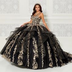 Dazzling quinceanera ball gown with gorgeous glittery tulle and natural waistline; the dress is completed with a fabulously ruffled tulle over the beautiful embroidered skirt. A matching detachable long cape is included. Ball Gown Gold, Royal Blue Quinceanera Dresses, Royal Blue Quinceanera, Masquerade Ball Gown, Black Quinceanera Dresses, Long Cape, Ruffle Fabric, Quinceanera Dress, Prom Designs