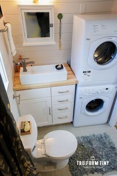 a washer and dryer in a small bathroom