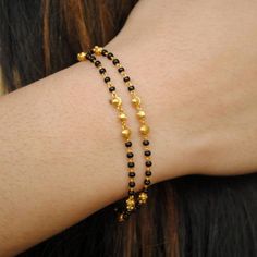 Gold Beaded Chain Rosary Bracelet With Round Beads, Gold Rosary Bracelet With Beaded Chain, Black Bracelet With Gold Beads, Handmade Gold Chain Bracelet With Round Beads, Black Beaded Bracelet As Gift, Black Beaded Chain Bracelet For Gift, Gift Black Beaded Chain Bracelet, Black Beaded Bracelets With Gold Beads For Gifts, Gold Rosary Bracelet With Black Beads As Gift