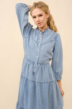 Garment Washed Chevron Yoke Tiered Snap Up Elastic Midi Denim Dress in light wash denim blue. Pair this cute western style denim dress with your favorite boots, a belt with cool buckle and a hat to really make a statement. Shop western style denim dresses at Bourbon Cowgirl. Select your size. Color: Light wash blue Trendy Light Wash Denim Dress For Fall, Light Wash Chambray Denim Dress, Light Wash Chambray Denim Dress For Fall, Trendy Chambray Denim Dress In Medium Wash, Trendy Medium Wash Chambray Denim Dress, Trendy Light Wash Denim Dress, Light Wash Denim Dress With Frayed Hem For Fall, Fall Light Wash Denim Dress With Frayed Hem, Trendy Light Blue Denim Dress