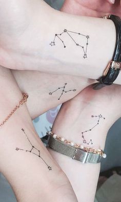 two girls with matching tattoos on their arms