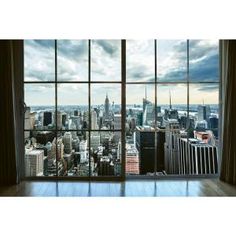 an empty room with large windows looking out on the cityscape and skyscrapers