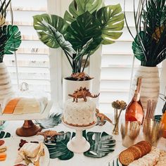 a table topped with lots of different types of desserts and drinks on top of it