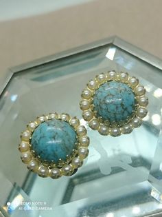 Old clip earrings circa 1950, round clips with large Beijing glass cabochons decorated with seed beads, women's gift Vintage 50s measurements: 2x2 cm materials: gold metal, Beijing glass, seed beads In good vintage condition Vintage clip-on earrings with Beijing glass. turquoise color. Dome-shaped cabochon. with seed beads The clips are very tender Good gift for wife Vintage Turquoise Earrings With Round Beads, Beaded Round Clip-on Earrings, Vintage Round Clip-on Jewelry, Vintage Beaded Round Earrings, Round Vintage Clip-on Jewelry, Retro Round Cabochon Jewelry, Turquoise Clip-on Round Jewelry, Turquoise Round Clip-on Jewelry, Retro Cabochon Jewelry