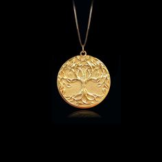 Discover our unique tree of life pendant, a timeless symbol of spirituality and interconnectedness. This pendant is a fine representation of spiritual symbolism and natural beauty. PENDANT INFORMATIONThis pendant is made of real, solid gold.• Made in USA• Material: 14k or 18k solid gold• Finish: polished• Height: 1.1" (28 cm) x Width: 0.95" (24 mm)• Pendant weight: approx. 6 grams (14k)• Bail: fits up to 4 mm chains• Solid back, not hollow• A certificate of authenticity is included• Delivered in Gold Jewelry For Blessing Events, Holistic Gold Pendant Jewelry, Sterling Silver Yellow Gold Tree Of Life Necklace, Yellow Gold Sterling Silver Tree Of Life Necklace, Nature-inspired Gold Necklace With Oval Pendant, Elegant Yellow Gold Tree Of Life Necklace, Tree Of Life Pendant Necklaces For Anniversary, Tree Of Life Round Pendant Jewelry For Anniversary, Symbolic Tree Of Life Round Pendant Jewelry