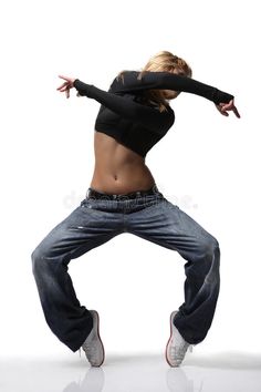 a woman in black shirt and jeans dancing