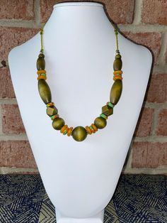 Hand dyed lime green wood bead necklace with recycled orange and multicolored glass beads from Africa. Wood beads were originally unfinished when purchased. After dying, beads are waxed and polished to a soft sheen. Seed beads and silver plated findings, including lobster claw clasp, were added to extend necklace to approximately 21 inches. Recycled Glass Bead, Wood Bead Necklace, Green Wood, Seed Bead Necklace, Silver Spring, Apple Green, Glass Bead Necklace, Recycled Glass, Beaded Pendant