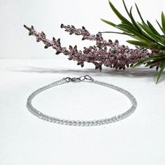 This dainty and very sparkly white topaz beaded gemstone bracelet is made with small approximately 2mm faceted round white topaz gemstones, carefully strung on flexible aluminum wire.  𝗢𝗣𝗧𝗜𝗢𝗡𝗦 + 𝗖𝗨𝗦𝗧𝗢𝗠𝗜𝗭𝗔𝗧𝗜𝗢𝗡 ● Different lengths are available for most pieces, allowing you to wear them as a bracelet, wrap bracelet, anklet, choker, or necklace. Most items can be customized to 1/8" or 1/4" increments - please leave a note at checkout! Send a message if you want a length not list Minimalist Crystal Bracelet With Faceted Beads, Bead Choker Necklace, Topaz Bracelet, Crystal Anklet, Bead Choker, Red Copper, Silver Jewelry Design, April Birthstone, Beaded Anklets