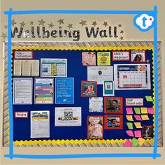 a bulletin board with pictures and writing on it that says, well being wall written in blue