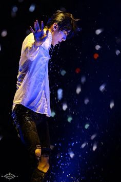 a man on a skateboard in the air with confetti falling around him