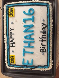 a birthday cake with blue icing and the words happy birthday written on it in black letters