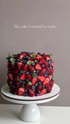 the cake i wanted to make is covered with berries and strawberries