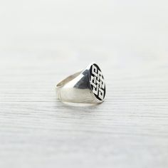 Our Eternal Knot signet ring is handcrafted by a fair-trade group of silversmiths in Nepal. Each sterling silver ring is stamped with the ancient symbol and polished by hand. Signet rings are not only appreciated for their aesthetic appeal but also for the symbolism or significance to the wearer. Historically used as a signature or a symbol of ones identity, these unique rings can carry a lot of meaning. The Endless, or Eternal Knot has special meaning throughout many cultures and can serve as a Ceremonial Sterling Silver Rings With Polished Finish, Ceremonial Sterling Silver Open Ring, Sterling Silver Rings With Polished Finish For Ceremonial Occasions, Sterling Silver Rings With Polished Finish For Ceremonies, Symbolic Sterling Silver Signet Ring With Polished Finish, Symbolic Sterling Silver Engraved Ring With Polished Finish, Ceremonial Sterling Silver Engraved Ring, Sterling Silver Symbolic Signet Ring With Polished Finish, Ceremonial Engraved Sterling Silver Ring