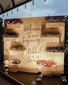 a sign with flowers on it that says welcome to our beginning neighborhood