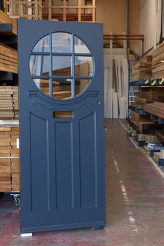 a large blue door sitting inside of a warehouse