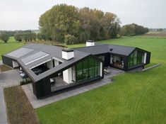 an aerial view of a modern house in the countryside