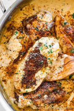 chicken with gravy and parsley in a pan