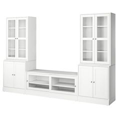 a white entertainment center with glass doors and shelves