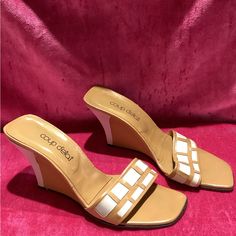 D E S C R I P T I O N Vintage Y2k Tan Colored And Leathered Wedges With A Tan And White Color Heel. This Shoe Is Also Opened Toed With A Tan And White Strap On The Front Of The Shoes. M E A S U R E M E N T Labeled As: Size 9 Insole Width: 3.75" Toe To Heel: 10" Heel Height: 4 1/2" Authenticity Guarantee All Items Sold In Our Shop Are 100% Guaranteed Authentic Or Your Money Back. Retro Beige Heels For Summer, Retro Beige Summer Heels, Retro Cream Heels For Summer, Vintage White Platform Heels, Cream Retro Heels For Summer, Retro White Synthetic Heels, White Retro Synthetic Heels, Retro White Open Toe Heels, White Retro Heels For Summer