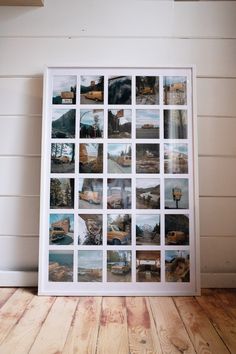 a white framed photo with many pictures on it sitting on a wooden floor next to a wall