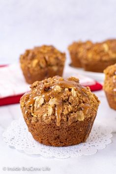 several muffins are sitting on a doily