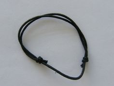 8 waxed cord knot bracelet Black 40mm adjustable Waxed cord Black Leather Bracelet With Adjustable Band, Black Adjustable Leather Bracelet, Casual Black Waxed Cord Bracelet, Minimalist Braided Bracelets With Adjustable Waxed Cord, Casual Black Braided Bracelet With Waxed Cord, Black Casual Friendship Bracelets With Adjustable Cord, Black Adjustable Braided Bracelet With Sliding Knot, Minimalist Braided Bracelets With Adjustable Cord, Adjustable Black Leather Bracelet With Waxed Cord