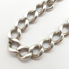 "An antique sterling silver chain bracelet with curb links. This piece was once a pocket watch albert chain and has graduating links, it has since had a modern clasp fitted and been converted to a bracelet. It measures approx. 24 cm or 9.5\", it is 7.3mm wide and weighs approx. 18.23g. Please check out the other items in my shop. Be sure to view all photos and videos for condition and read the titles and descriptions. Sizes are in the latter photos.  Don't hesitate to send me a message with any queries. All my items are used, some are very old, therefore may show signs of wear or use and are all sold as seen. I'll try and point out any defects but please satisfy yourself using the pictures, what you see is what you will receive. I test all precious metals with acids and gemstones with a th Sterling Silver Curb Chain Bracelet With Oval Links, Silver Oval Link Curb Chain Bracelet, Silver Curb Chain Bracelet With Oval Link, Silver Curb Chain Link Bracelet, Vintage Chain Bracelet With Curb Chain Link, Silver Curb Chain Bracelet, Vintage Sterling Silver Link Chain Bracelet, Vintage Silver Chain Link Bracelet, Vintage Silver Curb Chain Jewelry