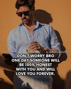 a man standing in front of a yellow wall with a quote on it that reads, don't worry, bro one day someone will be 10 % honest with you and will love you and will love you forever