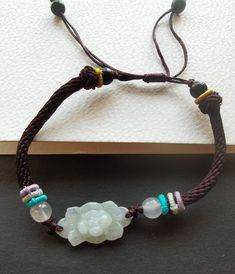 "Weave Rope lotus flower Natural Burmese jadeite jade,stone bead bracelet,Grade A,amulet,protector,mood,good lucky gift,gemstone,Yoga Jewelry material: natural jadeite jade stone,rope  Size:  flower : approx. 12mmx24mmx5mm Rope Color: brown color length:6\"-9\" style: weave rope,adjustable bracelet Price: one bracelet ❤ If you want other length Bracelet, Please connect me free. ❤Please read the store policy before purchase. ❤ Thank you for visiting my shop!" Adjustable Jade Jewelry For Meditation, Jade Bracelets With Natural Stones For Good Luck, Spiritual Jade Bracelets For Good Luck, Good Luck Jade Bracelets Spiritual Style, Good Luck Bracelets With Natural Jade Stones, Handmade Jade Bracelets For Meditation, Traditional Jade Jewelry For Meditation, Traditional Adjustable Jade Bracelets, Traditional Adjustable Jade Bracelet