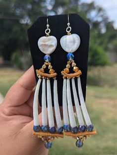 These elegant 1-Tier Dentillium Earrings are crafted by a Native American artisan. Featuring a single tier of slender dentillium shells, these earrings showcase the natural beauty and cultural significance of traditional Native American jewelry. Lightweight and graceful, they offer a simple yet striking design that complements both everyday wear and special occasions, connecting the wearer to rich Indigenous heritage. Dentilium Earrings, Dentillium Earrings, Dentallium Earrings, Indigenous Jewelry, Maximalist Jewelry, Native American Jewellery, Native Earrings, Beautiful Beaded Earring, Cultural Crafts