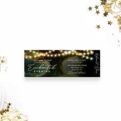 an elegant evening event ticket card with lights and confetti on the table next to it