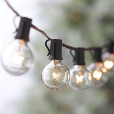 some light bulbs are hanging from a string