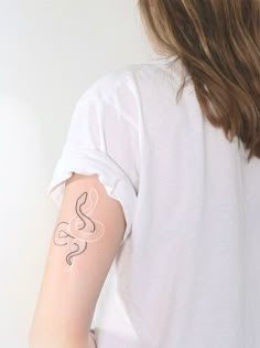 a woman with a tattoo on her arm