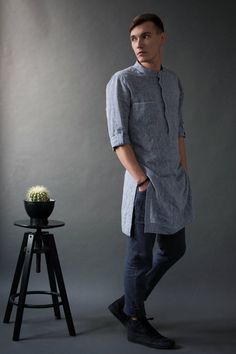 "A classic style redefined with modern styling, we created a linen tunic for men to fill that gap in your everyday wardrobe. The linen shirts are breathable and durable to provide maximum comfort, and they've kept it simple with roll-up sleeves and button-up closure. Step out in style no matter the occasion with a little help from our signature linen tunic. Handmade by masters of their craft in Lithuanian, where skills have been passed down for generations, your wardrobe's latest addition is sur Tunic Men, Long Shirt Men, Mens Dress Shirts, Kaftan Style