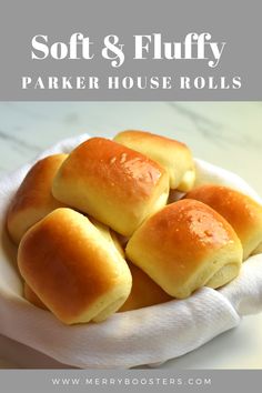 soft and fluffy parker house rolls in a white bowl