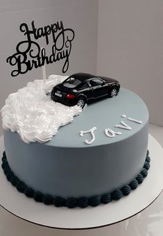 a birthday cake with a car on top