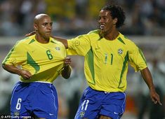 two soccer players in yellow and blue uniforms