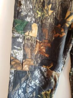 These are a vintage pair of, Mossy Oak Apparel, camouflage, hunting pants. They are a men's, size 36 x 34. They have little tabs for cinching at the waist and drawings in the bottom of the pantlegs. On the interior of one of the pantlegs is a large mark. You can see this in the images. The price reflects this. All sales are final. Don't forget to stop in at my other Etsy shop... http://www.etsy.com/shop/xtdesigns. Follow me on Twitter at... MyYiayiaHadThat@MyYiayiaHadThat. If you have a wish lis Khaki Cargo Pants For Hunting With Pockets, Khaki Cargo Pants With Pockets For Hunting, Military Camouflage Hunting Pants, Khaki Hunting Pants With Pockets, Military Style Camouflage Pants For Hunting, Military Style Hunting Bottoms With Pockets, Military Hunting Bottoms With Pockets, Camouflage Hunting Pants With Pockets, Military Cargo Pants With Pockets For Hunting