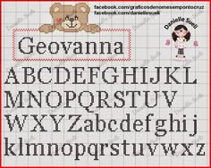 a cross stitch alphabet with a teddy bear on the front and bottom, in red frame